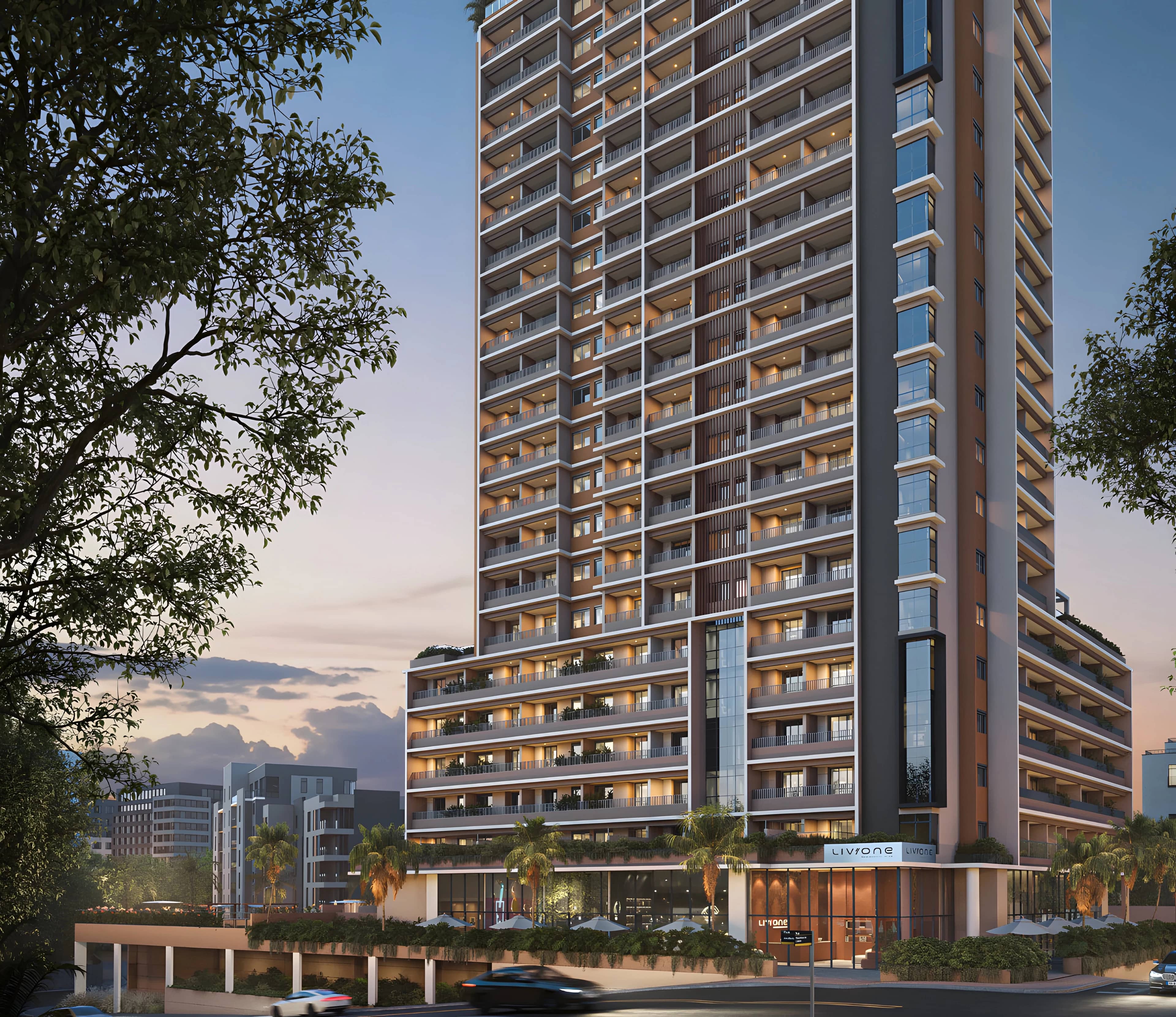 Torre do Liv One ao entardecer, com árvores em primeiro plano