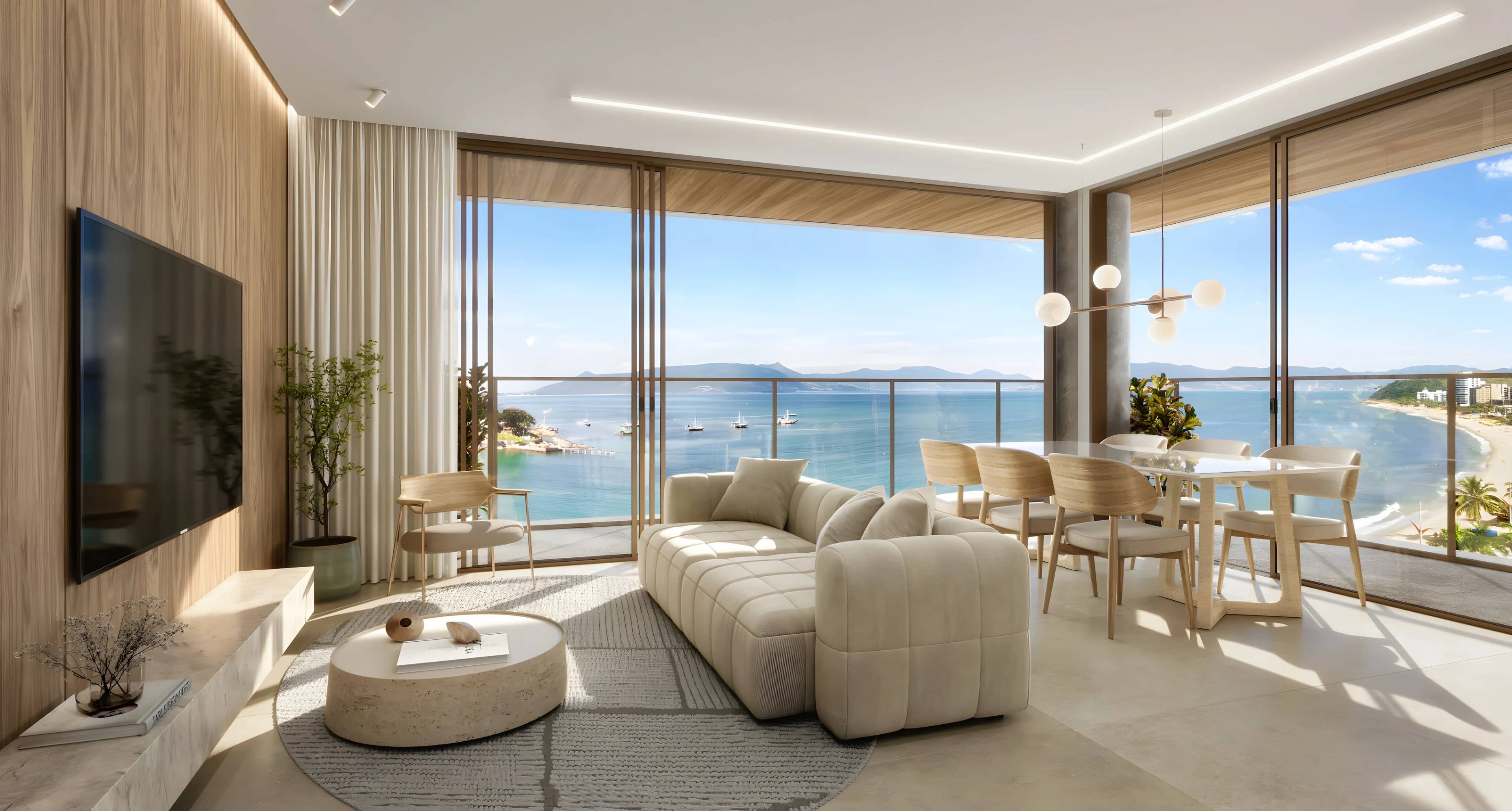 Living do duplex do Scenarium com mesa de jantar e vista para o mar