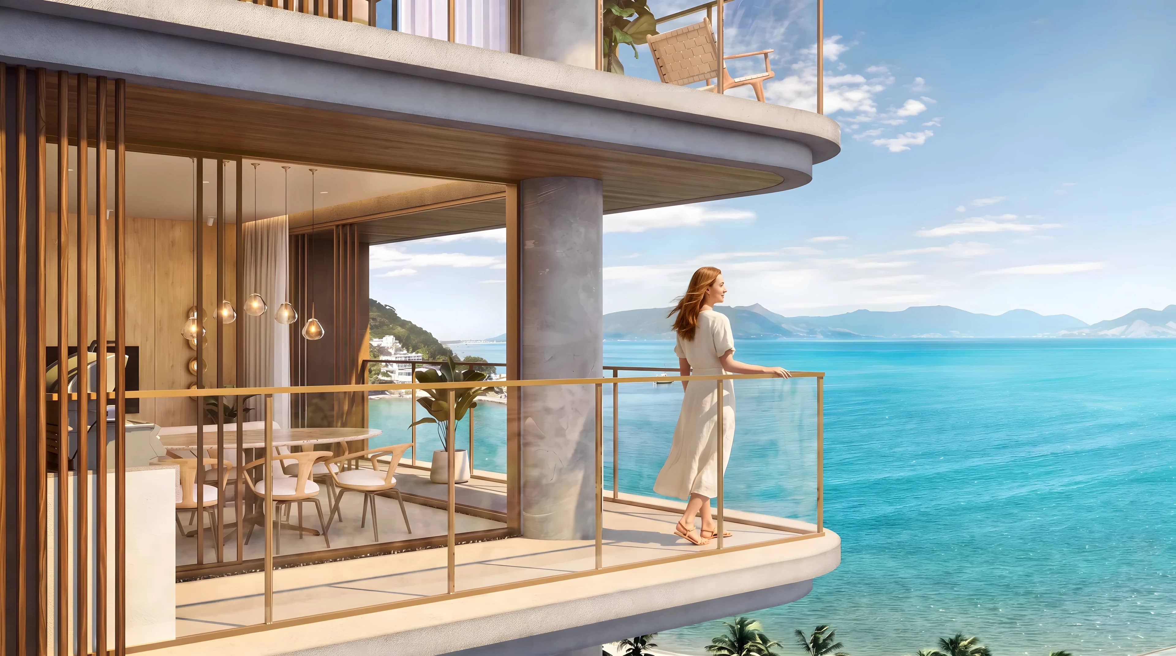 Varanda de apartamento do Scenarium com mulher olhando o mar e as montanhas