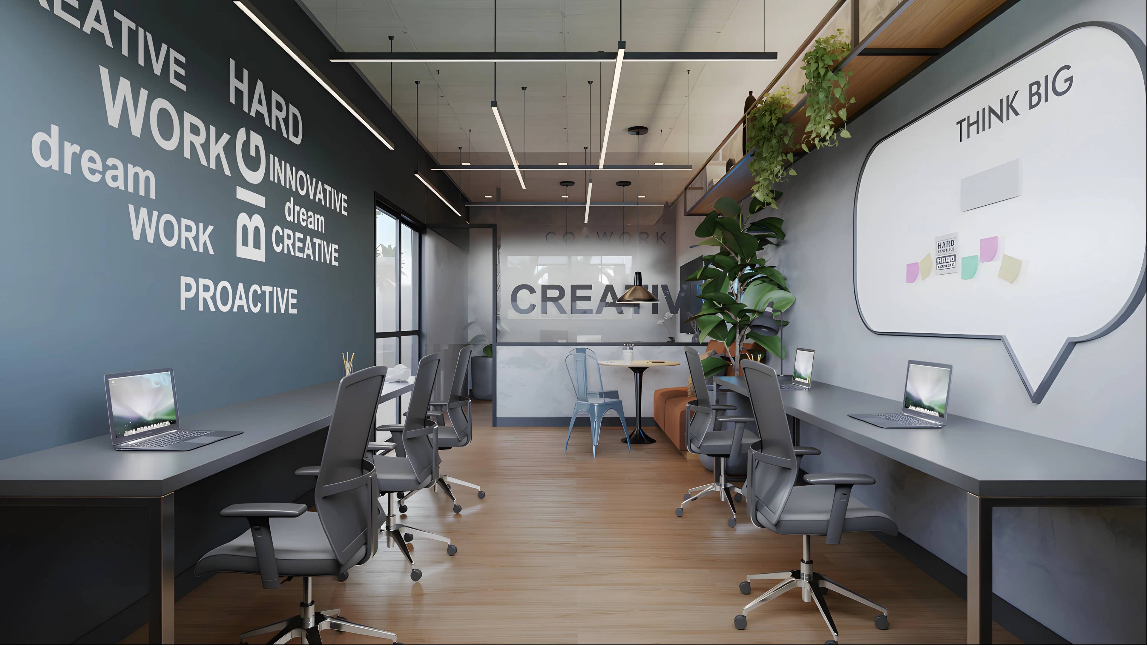 Coworking do Next Home com mesas de trabalho, cadeiras e parede com frases